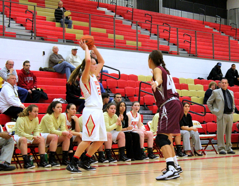 Kayla Feairheller lobs a pass cross-court during King's 70-50 home loss to No. 24 Eastern University on Wednesday night